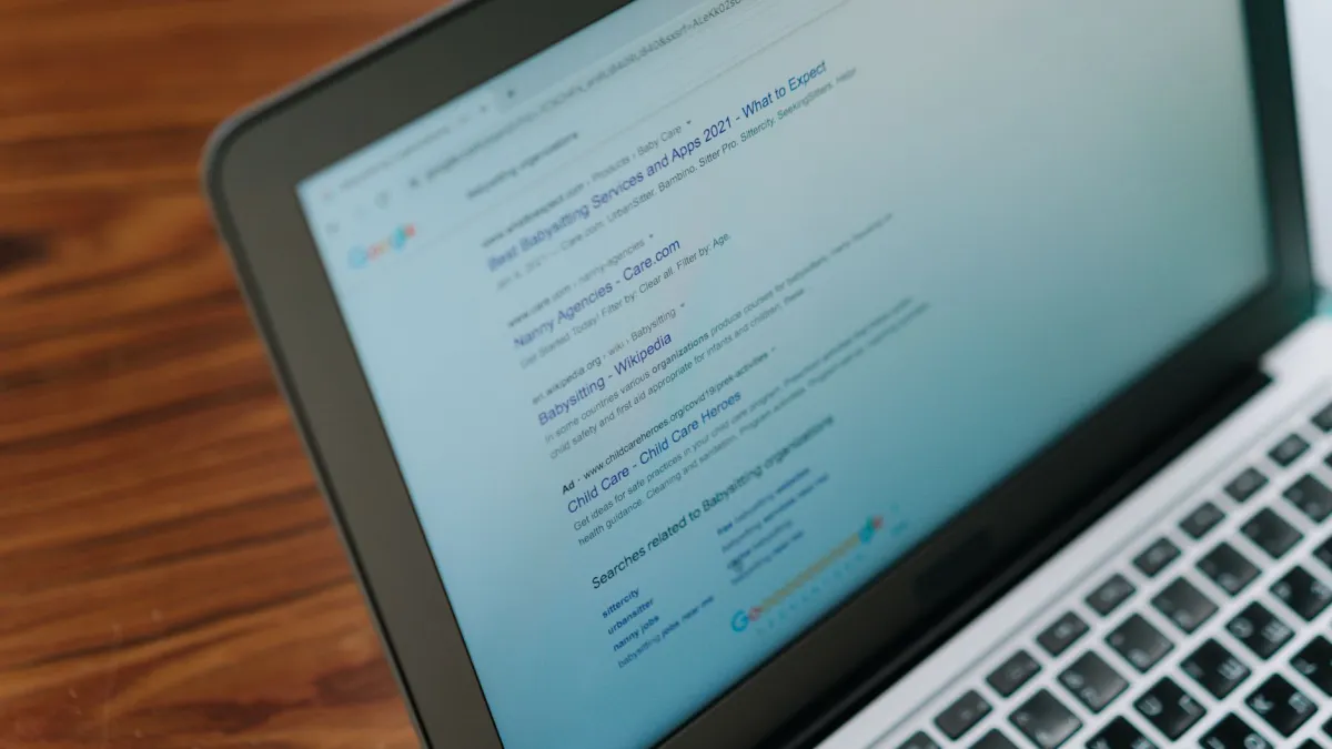 A close-up view of a laptop displaying a search engine page.